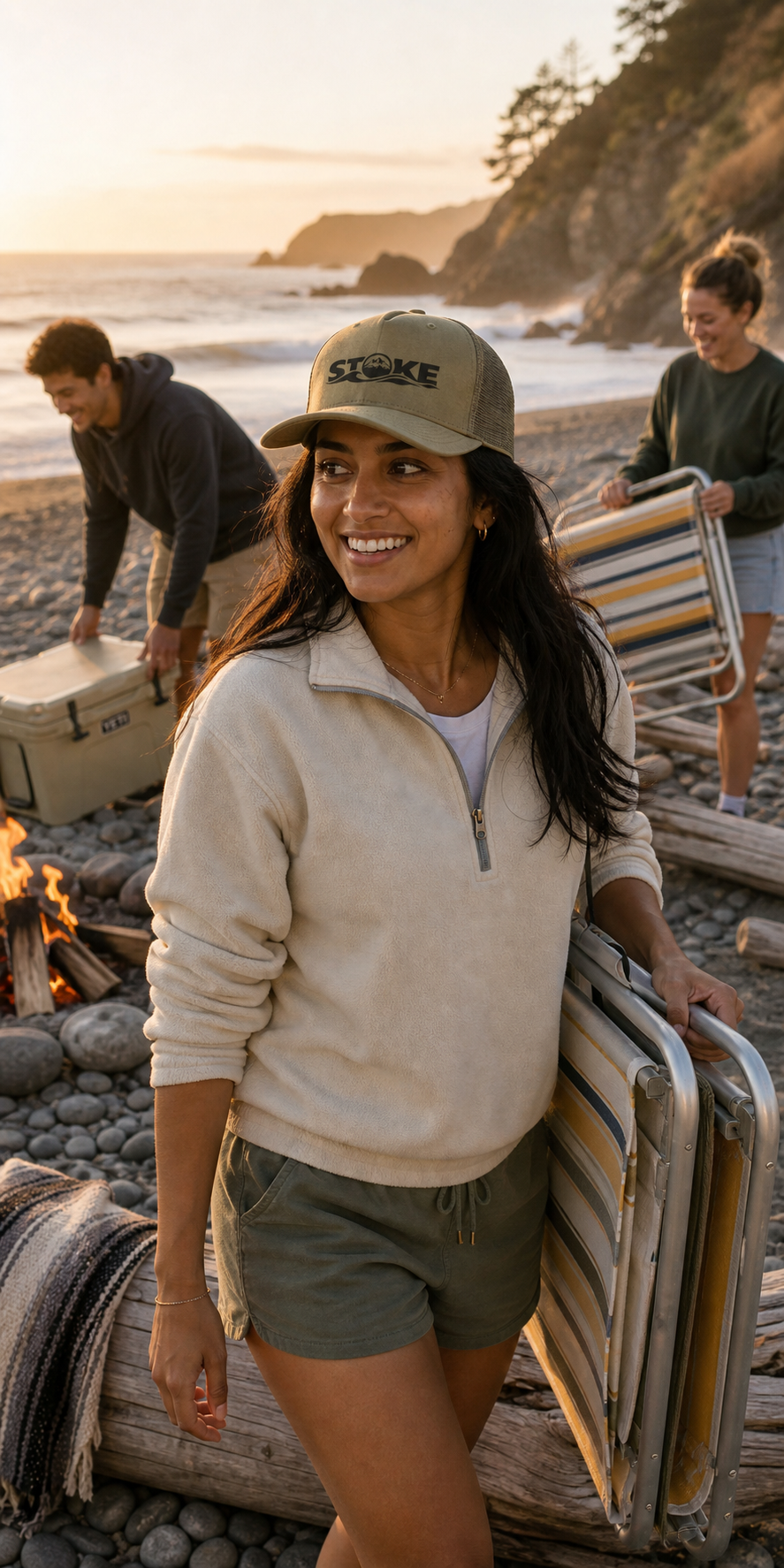Beach setup lifestyle shot wearing the STOKE Trailhead Trucker Cap in Loden